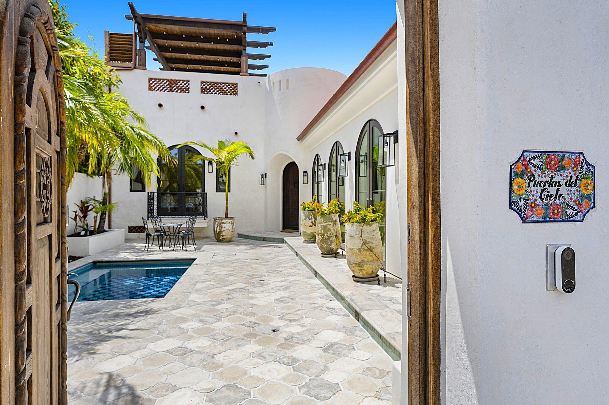 Exterior courtyard showcasing private outdoor swimming pool