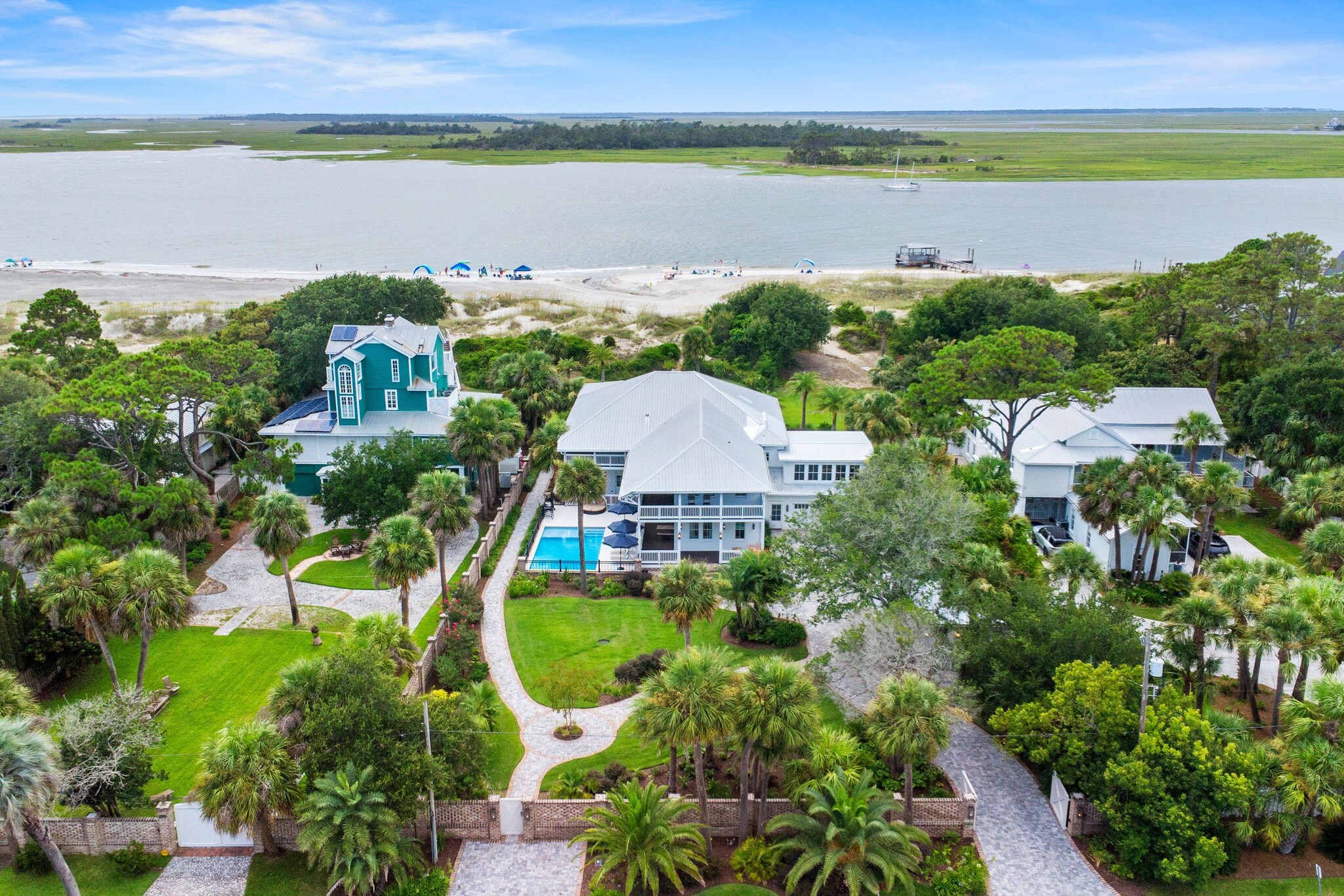 Aerial view of homes with access to nearby beach.