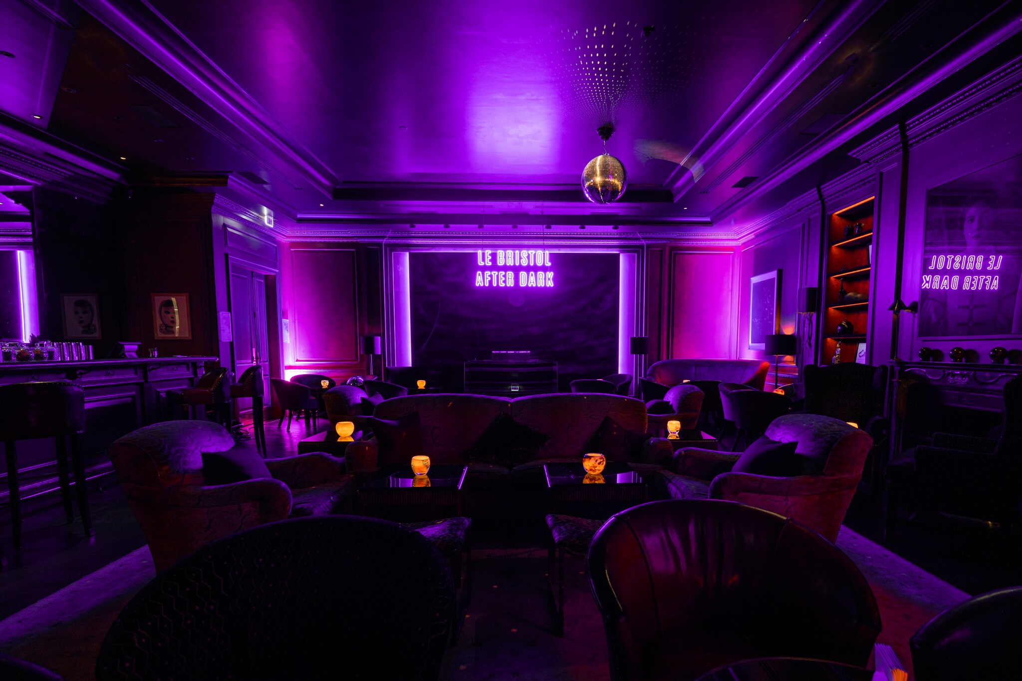 Bar du Bristol is dark, with only a few pink lights and small table candles winking off a disco ball to illuminate the dancefloor and armchairs.