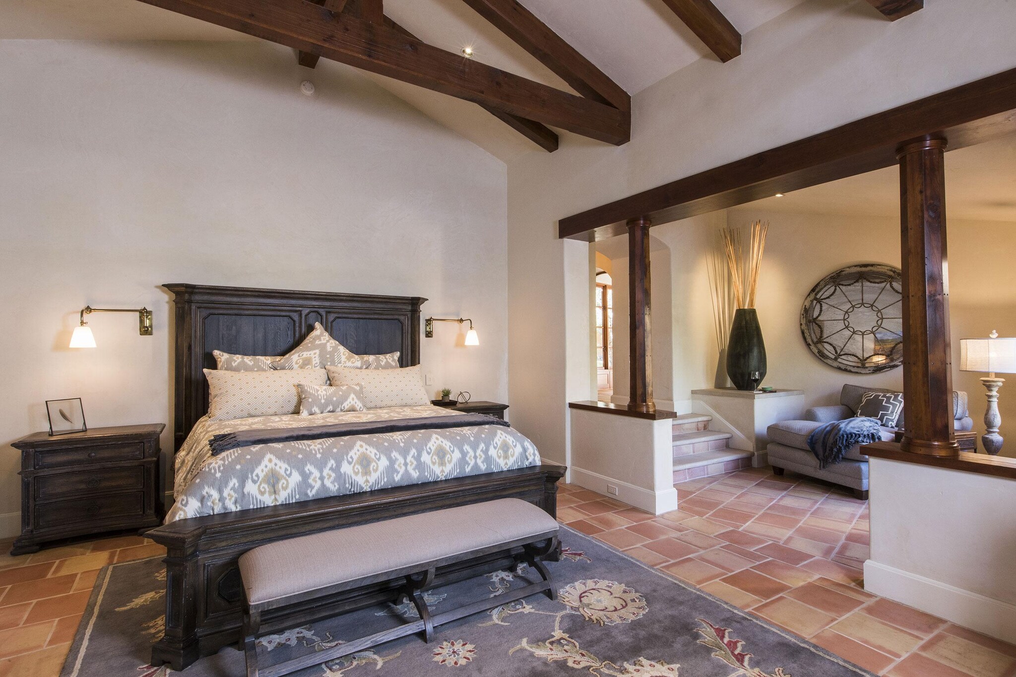 Interior of bedroom and sitting area of Spanish-style ranch house.