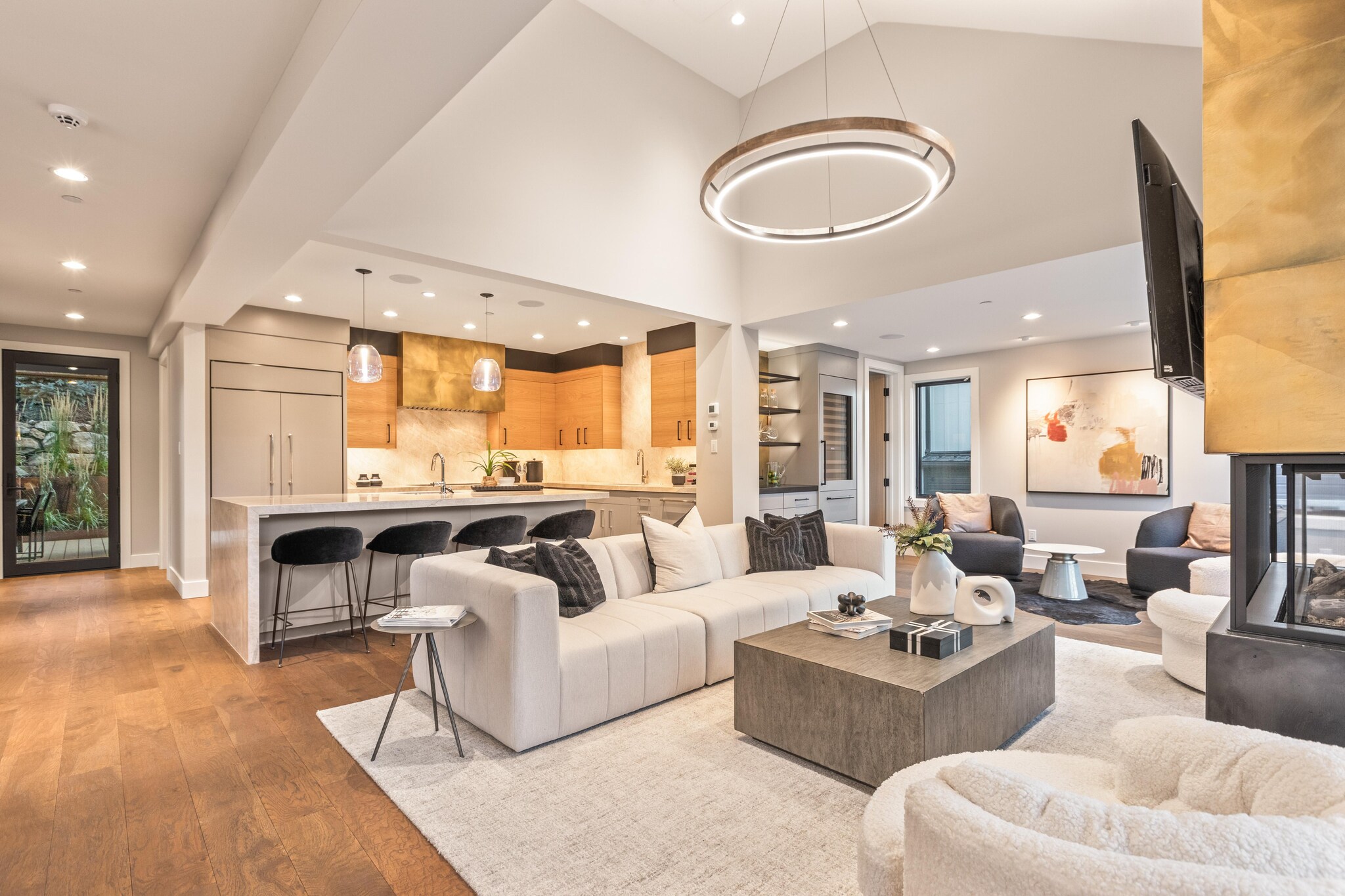 Interior of kitchen, dining, and living areas of house.