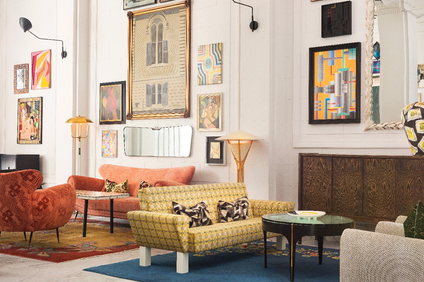 The lobby of the San Francisco Proper hotel is bright and funky, with colorful patterned couches and eclectic art on the white walls.