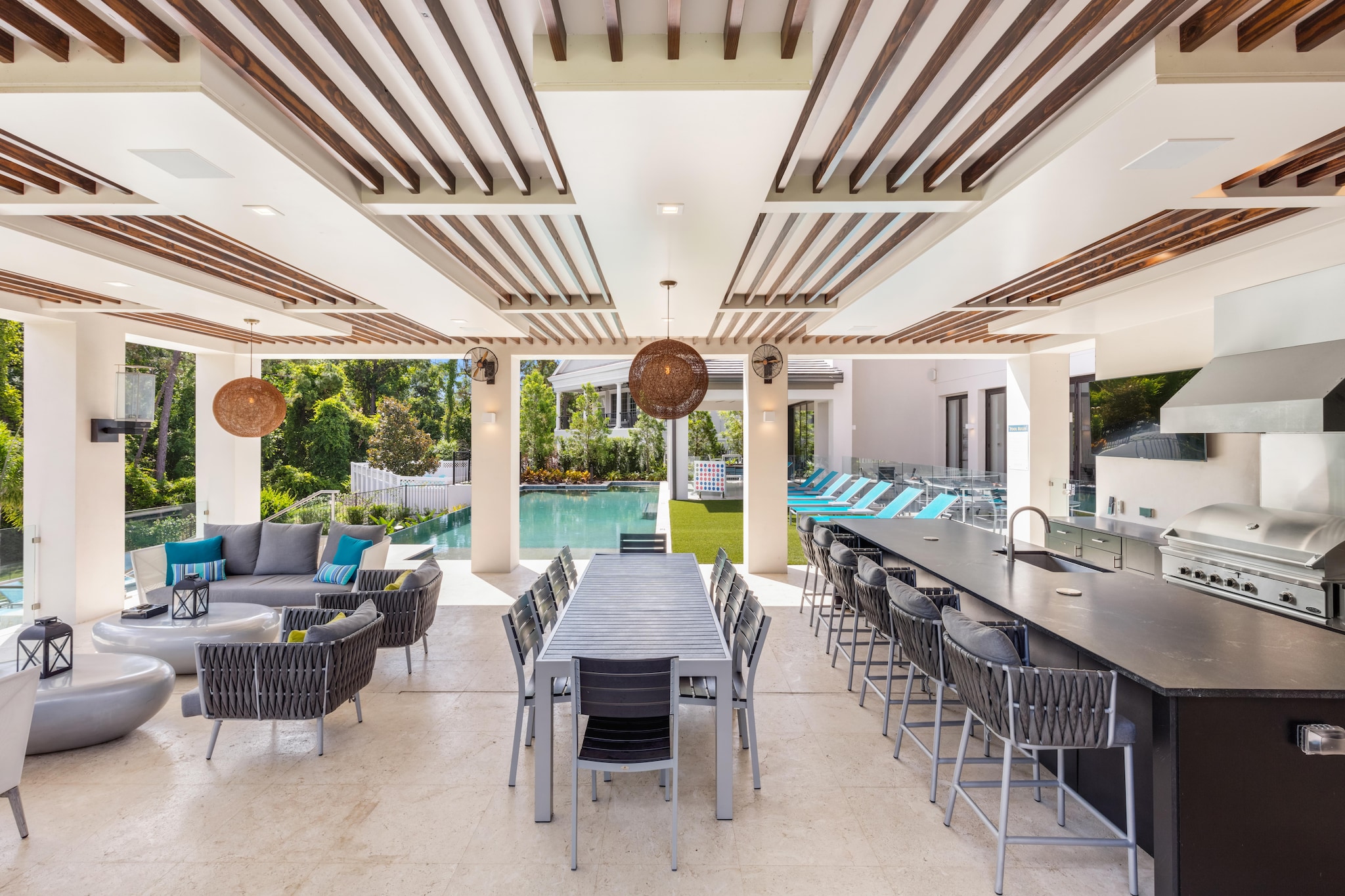 Expansive outdoor patio with large outdoor kitchen and seating area.