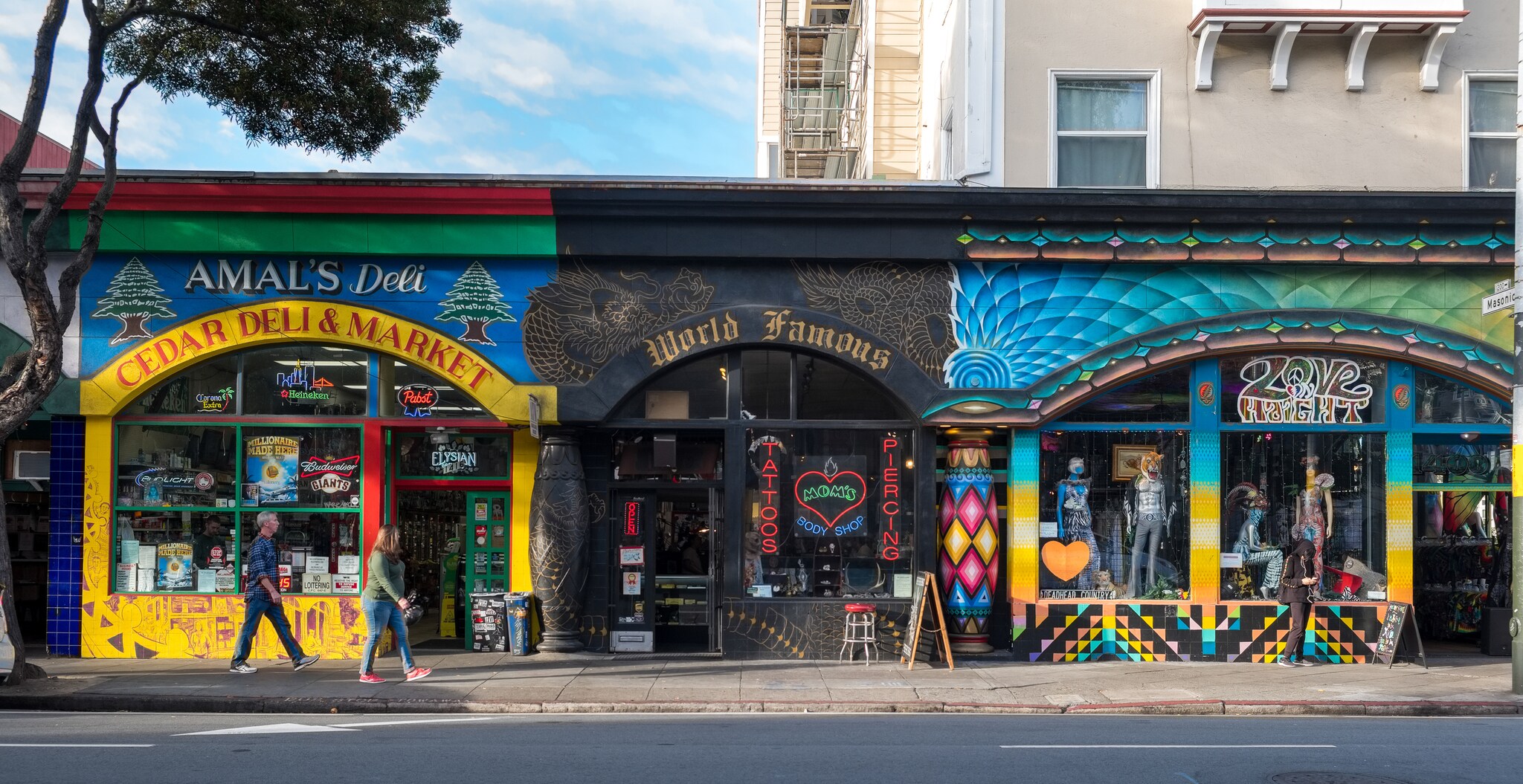 Storefronts on Haight-Ashbury advertise Middle Eastern groceries, tattoos, and wild, fashionable clothes.