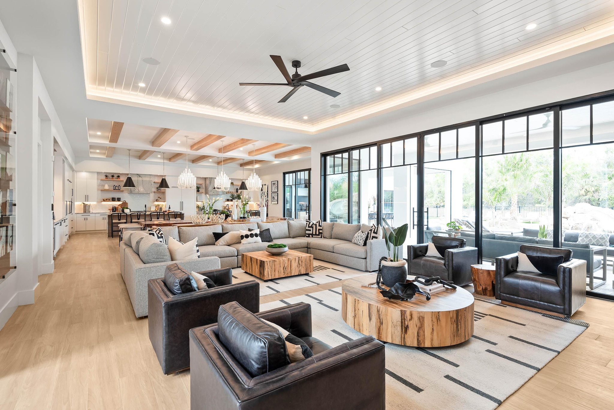 Bright and modern large living and dining area with large patio doors leading to outdoor patio area