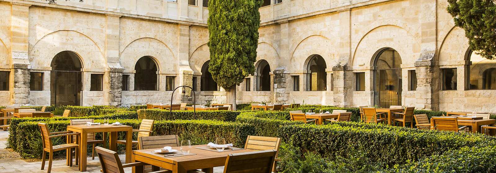 Hotel courtyard with outdoor dining tables