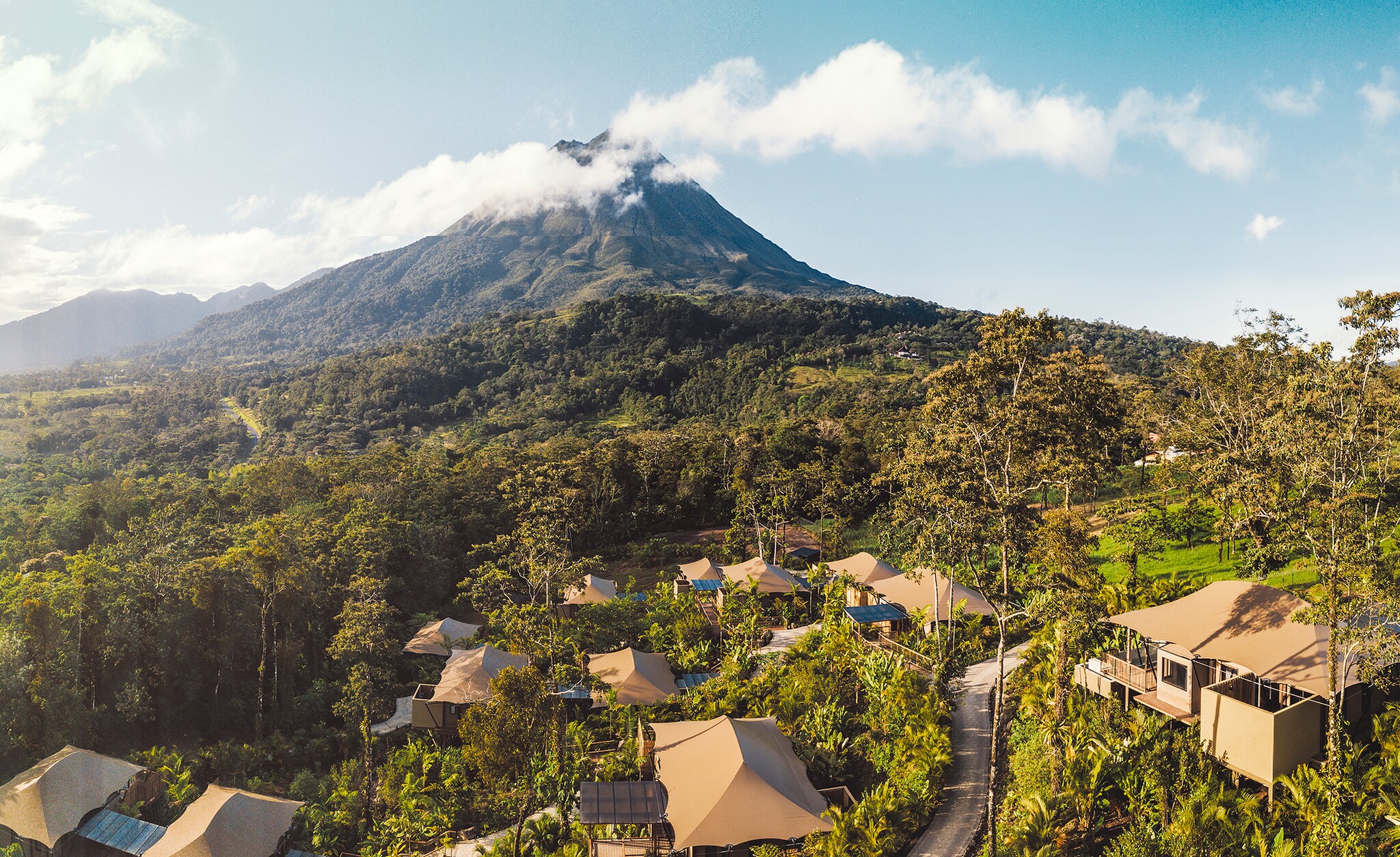 Aerial view of property and mountain peak