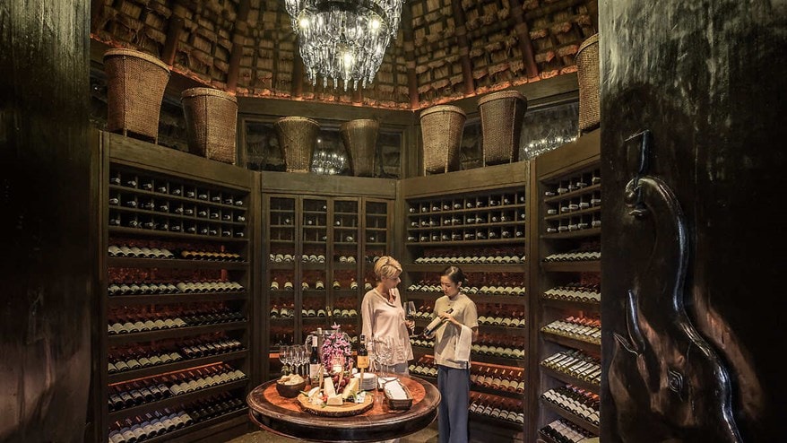 Sommelier and guest in wine vault