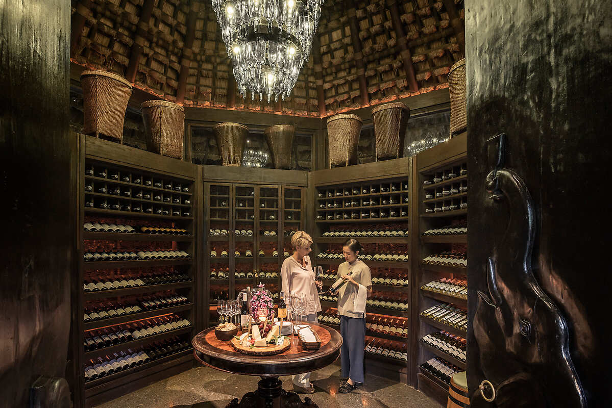 Sommelier and guest in wine vault
