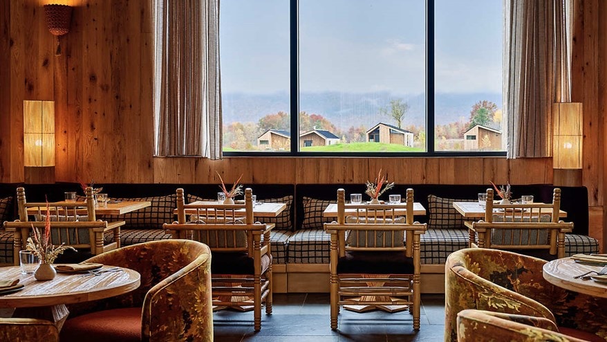 Dining room window with cabins in distance
