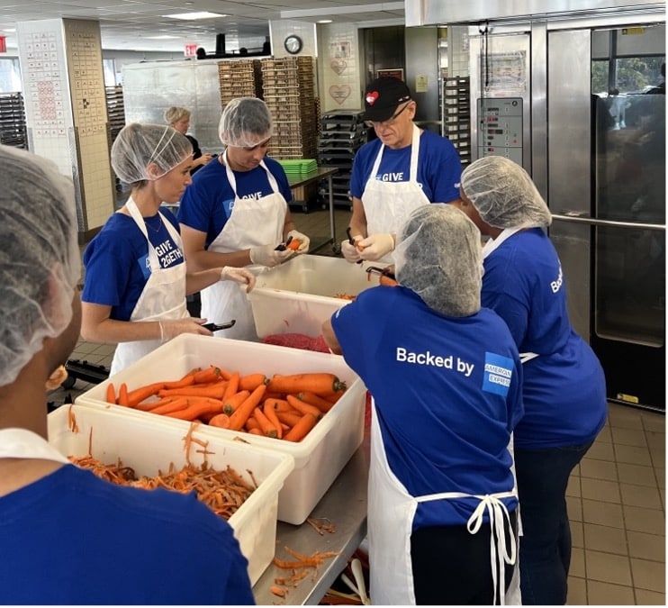 Volunteers at Give2Gether prepping food Volunteers at Give2Gether prepping food