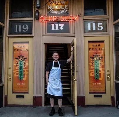 Man standing outside of business Man standing outside of business